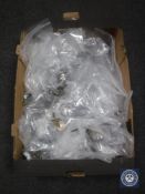 A box containing assorted furniture restoration pieces, ceramic castors, brass drawer handles,