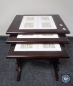 A nest of three tile inset tables