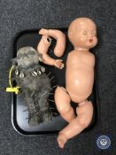 An African carved figure with nail and shell decoration,