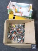 A toy fort together with a large quantity of plastic warrior figures.