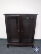 A reproduction mahogany display cabinet
