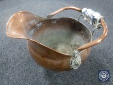 A Victorian copper coal helmet