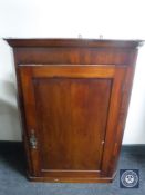 A 19th century corner cabinet
