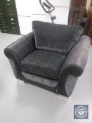 An armchair in cloth and leather fabric