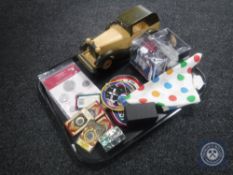 A tray of Space sew on badges, replica coins, wooden model of vintage car,