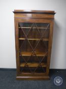 A continental mahogany glazed door bookcase