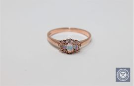 A 9ct gold opal and diamond ring,