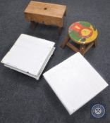 A pair of painted 19th century stools together with two other wooden footstools