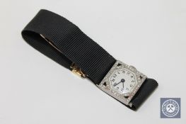 A superb quality 1920's platinum set diamond and sapphire Art Deco wristwatch on a large 18ct