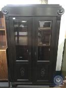 An early 20th century continental oak double door cabinet