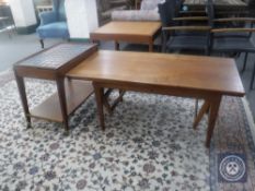 A Danish teak extending coffee table together with a teak two tier tile top trolley