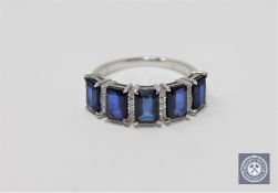 A 14ct white gold sapphire and diamond ring featuring 5 emerald cut natural sapphires 2.