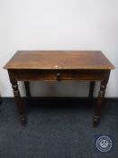 An antique pine hall table fitted a drawer