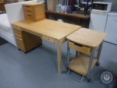 A contemporary pine effect computer desk together with a three drawer under desk filing chest,