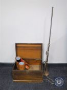 A mahogany storage box, long brass horn, leather cased binoculars,
