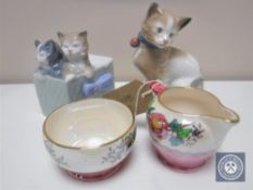 A Maling peony rose milk jug and sugar basin and two Nao figures