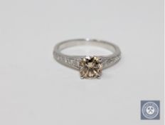 A 14ct white gold diamond solitaire ring featuring one round brilliant cut diamond 1.