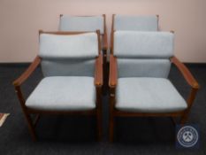 A set of four mid 20th century Danish teak armchairs with leather sling arms,