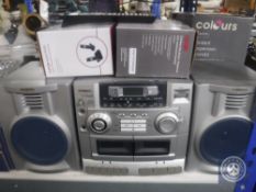 An LCD TV together with an Aiwa hifi system,