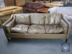 A late 20th century Danish brown leather three seater settee