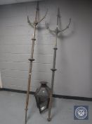 Two antique cast iron three way gas light posts and a glass and metal lantern