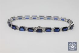 A 14ct white gold sapphire and diamond tennis bracelet, featuring 20 sapphires 12.