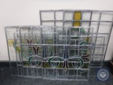Eight unframed stained leaded glass windows