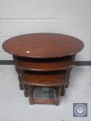 A nest of three oak tables