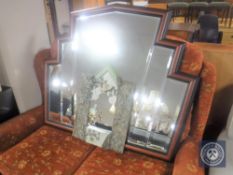 An ornate mirror together with a mahogany framed bevelled fan mirror