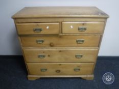 A late Victorian pine five drawer chest