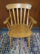 A pine kitchen armchair