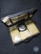 A cased Harlequin picnic set