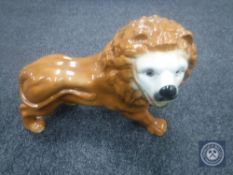 A 19th century Staffordshire lion figure