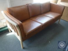 A 20th century Danish brown leather wooden framed settee CONDITION REPORT: 200cm
