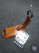 A large wooden ham hock holder together with a metal pasta maker