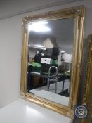 A Victorian style gilt framed bevelled mirror