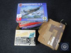 Nine boxed jigsaws together with two projectors