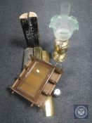 A brass embossed oil lamp with glass chimney and shade together with a brass fire curb and curio