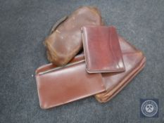 A leather Gladstone bag together with a leather satchel and two wicker picnic baskets