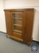 A continental oak glazed bookcase,