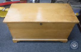 An antique pine blanket chest