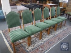 A set of six continental oak high back dining chairs upholstered in green striped fabric