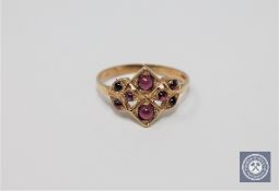 A 9ct gold cabochon garnet set ring,