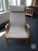 A beech framed Hessian upholstered armchair