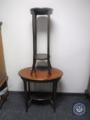 A late Victorian mahogany oval occasional table together with a plant stand