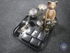 A tray of plated items, teddy bear figure, five boxed St.