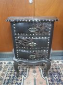 An embossed leather three drawer chest