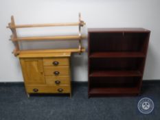 A pine cabinet fitted five drawers together with a pine plate rack and a set of mahogany effect