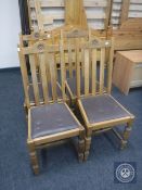 A set of four 20th century oak dining chairs