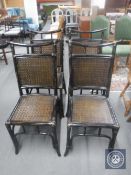 A set of four wicker and bamboo Chinese style dining chairs